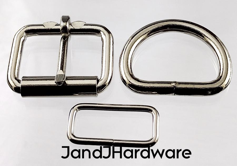 1 1/4 inch nickel plated maker pack consisting of 2 each of a heel bar roller buckle, D ring and a deluxe belt keeper.