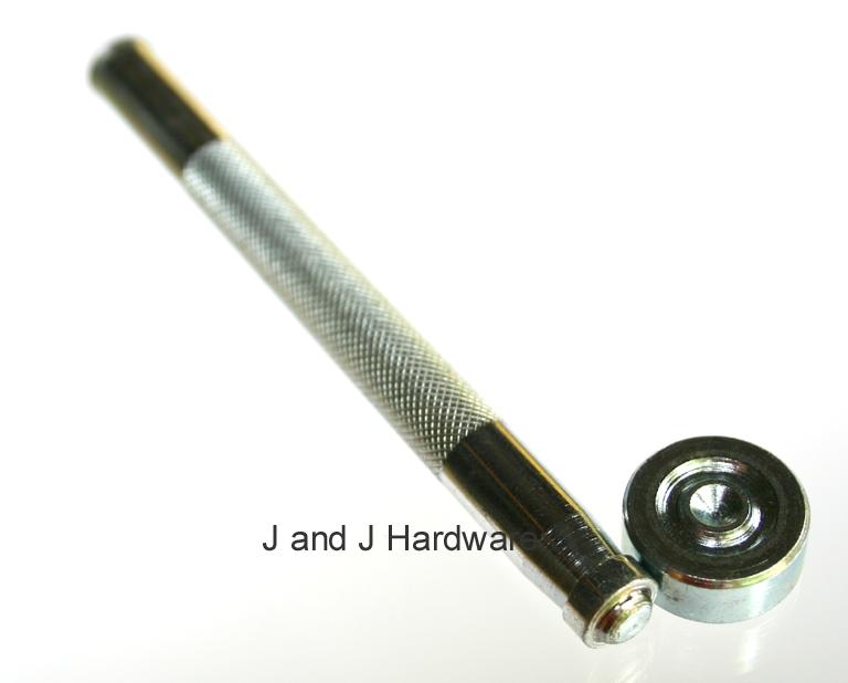 An image of a grommet setter complete with setting anvil.