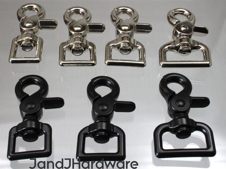 An image of a group of Swivel Clips in nickel and black plated finishes.